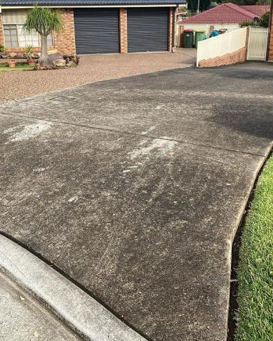 Dirty concrete driveway in Nowra before pressure washing